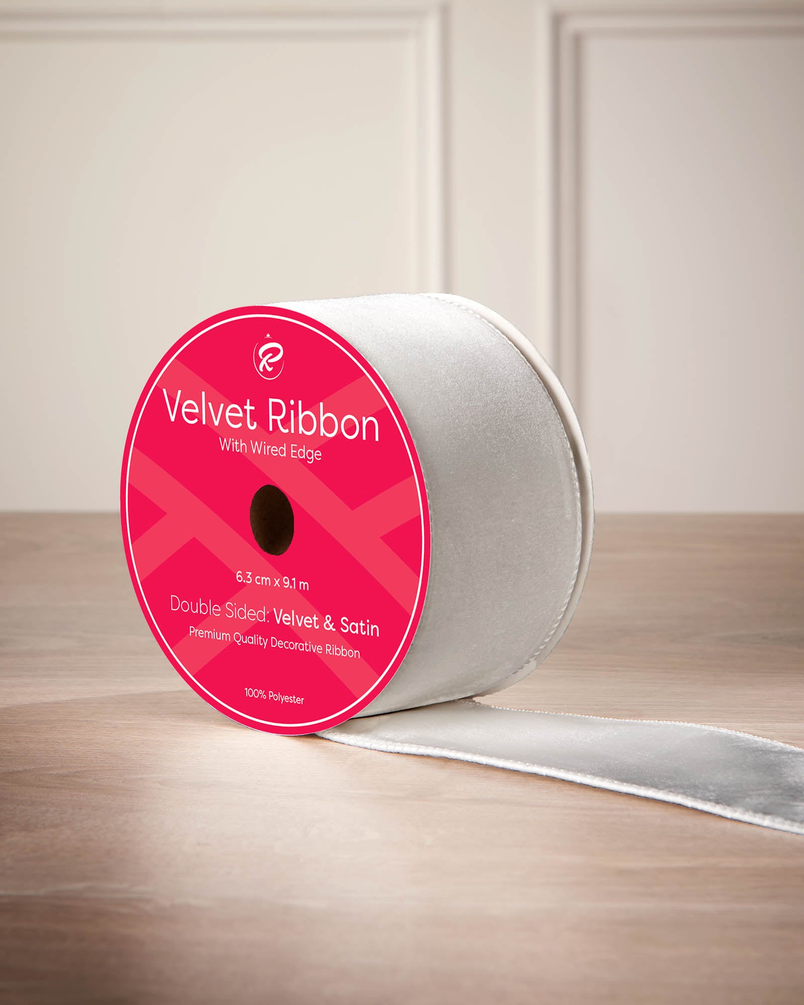 6 cm silver velvet ribbon on a spool with wired edge and 9 m length shown on the label.