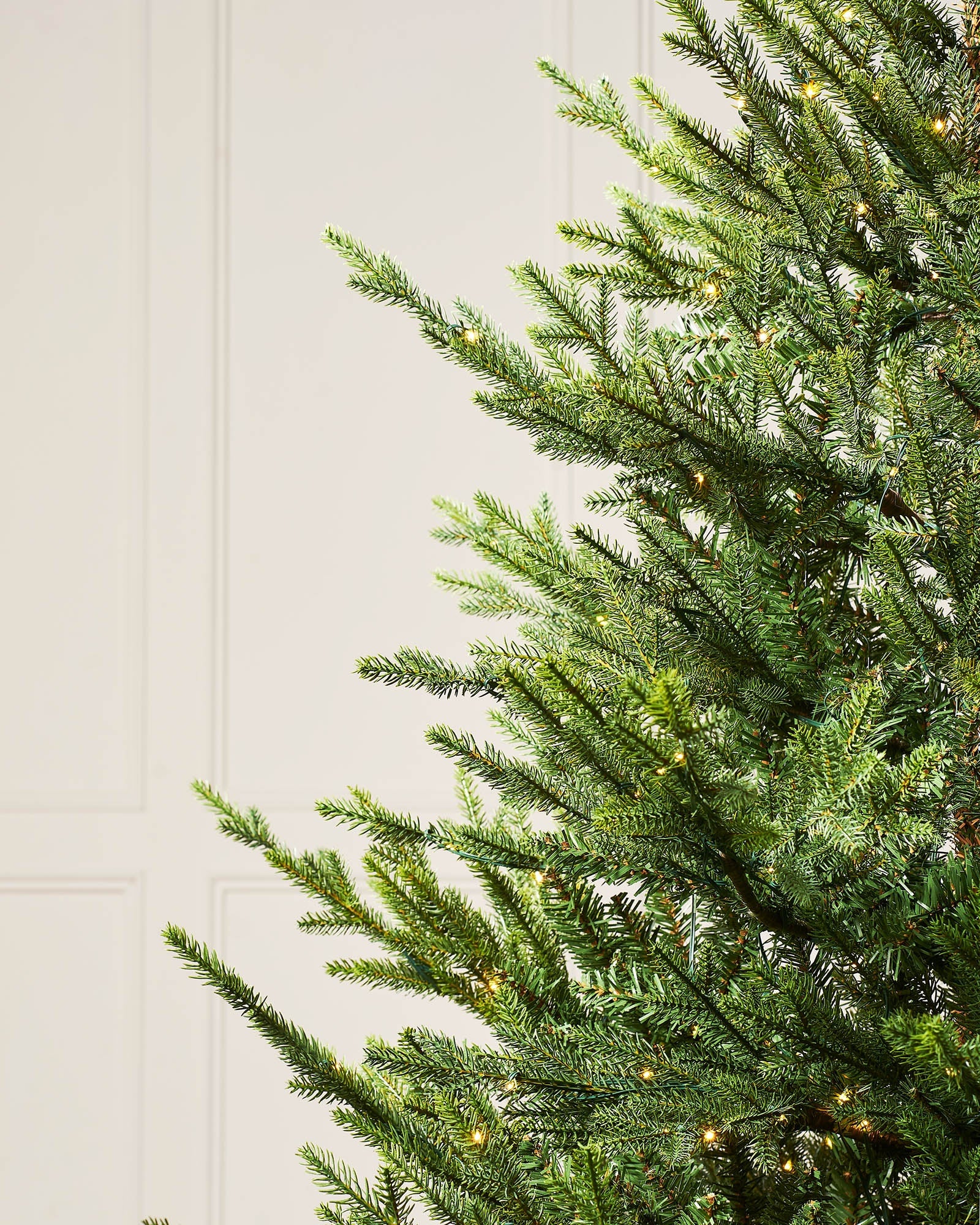 Close-up of realistic Douglas fir branches with warm white LEDs