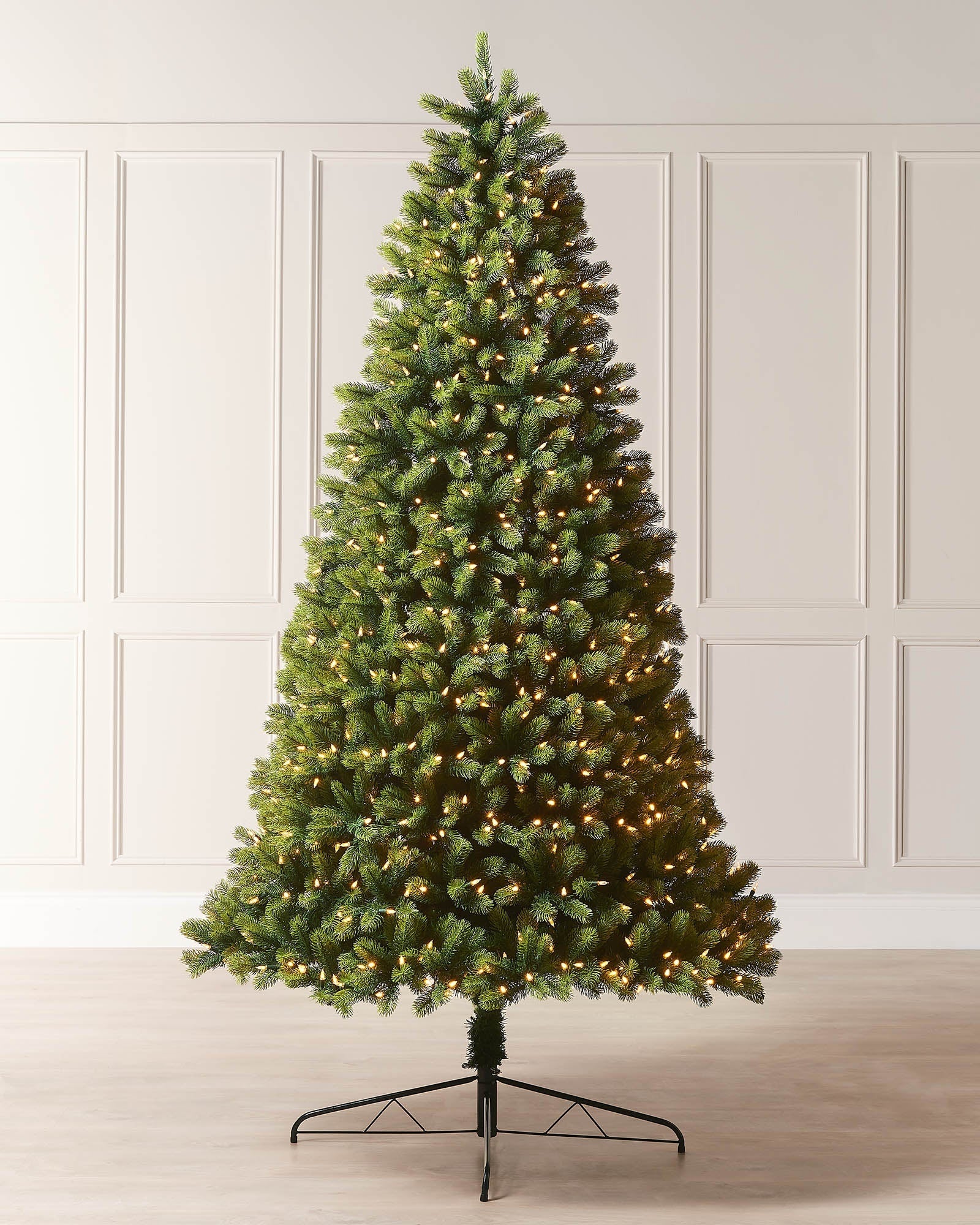 6ft pre-lit mixed pine half Christmas tree displayed indoors with warm white lights and a space-saving flat-back shape.