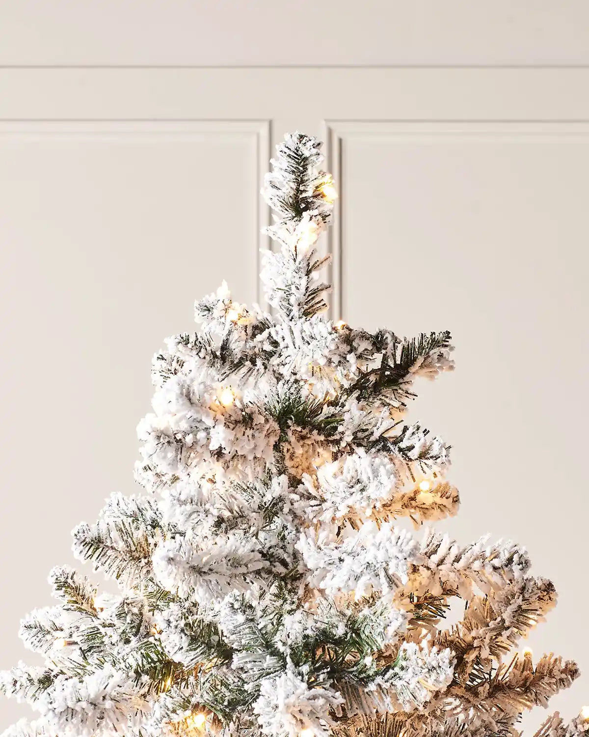 Top section of 6 ft pre-lit snow flocked Alpine Christmas tree