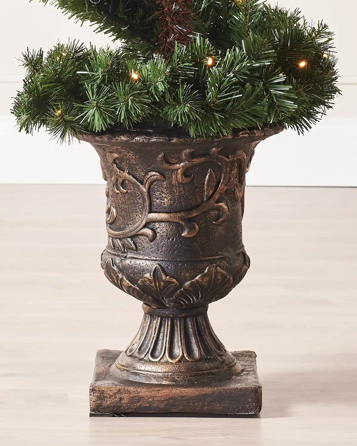 Close-up of the decorative pot base on the pre-lit spiral Christmas tree