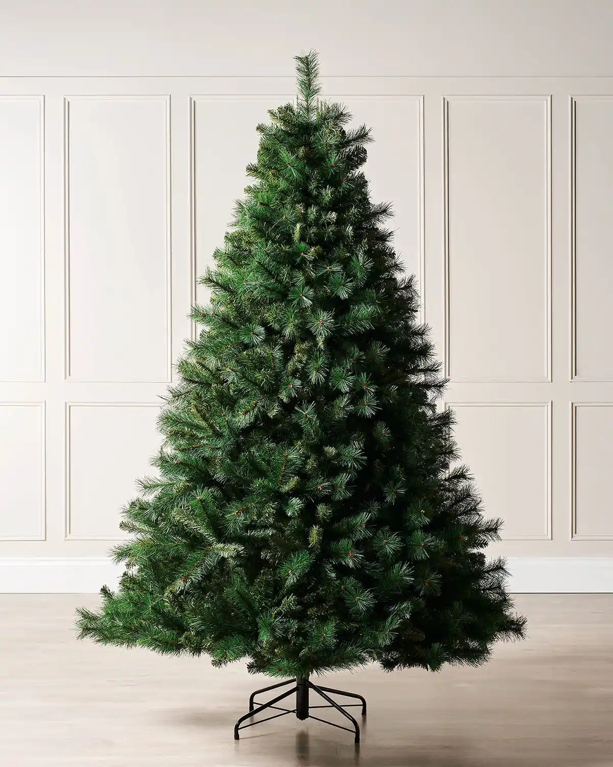 6ft Unlit Victorian Pine Christmas tree with a Black tree stand on a cream panel textured background 