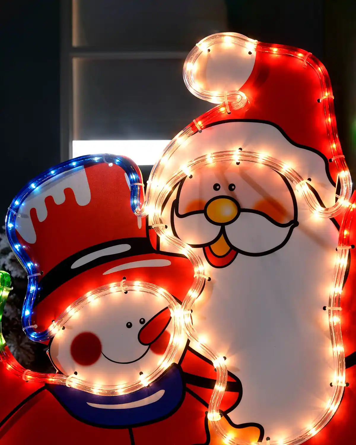 Close-up of the Santa and snowman rope light showing the illuminated faces and coloured details