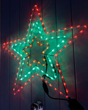 72cm animated flashing star light with red, green and amber LEDs displayed on a wall