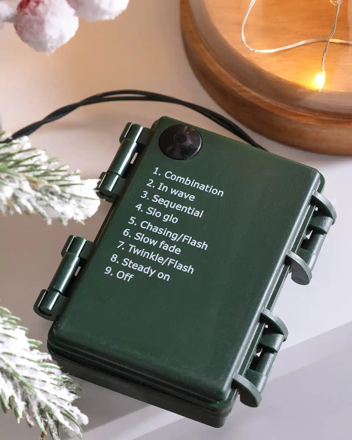 Close-up of the battery controller showing the light function settings for the pre-lit Christmas wreath