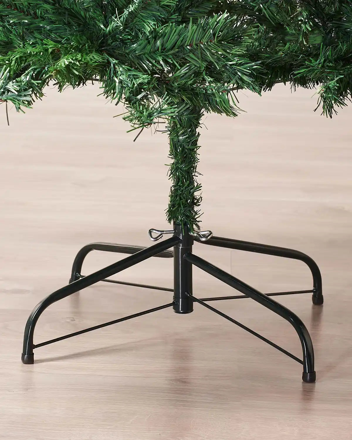 Close-up of the black metal stand on a 7 ft mixed pine artificial Christmas tree