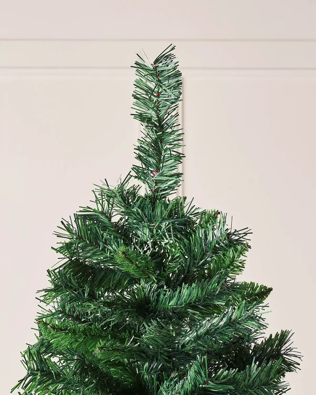 Close-up of the top section of a 7 ft mixed pine artificial Christmas tree