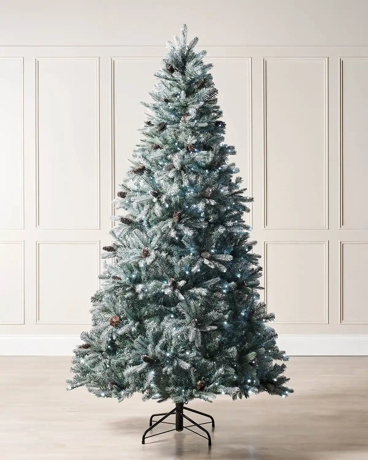 7 ft pre-lit Edwardian Spruce Christmas tree with frosted branches, pinecones and bright white LEDs