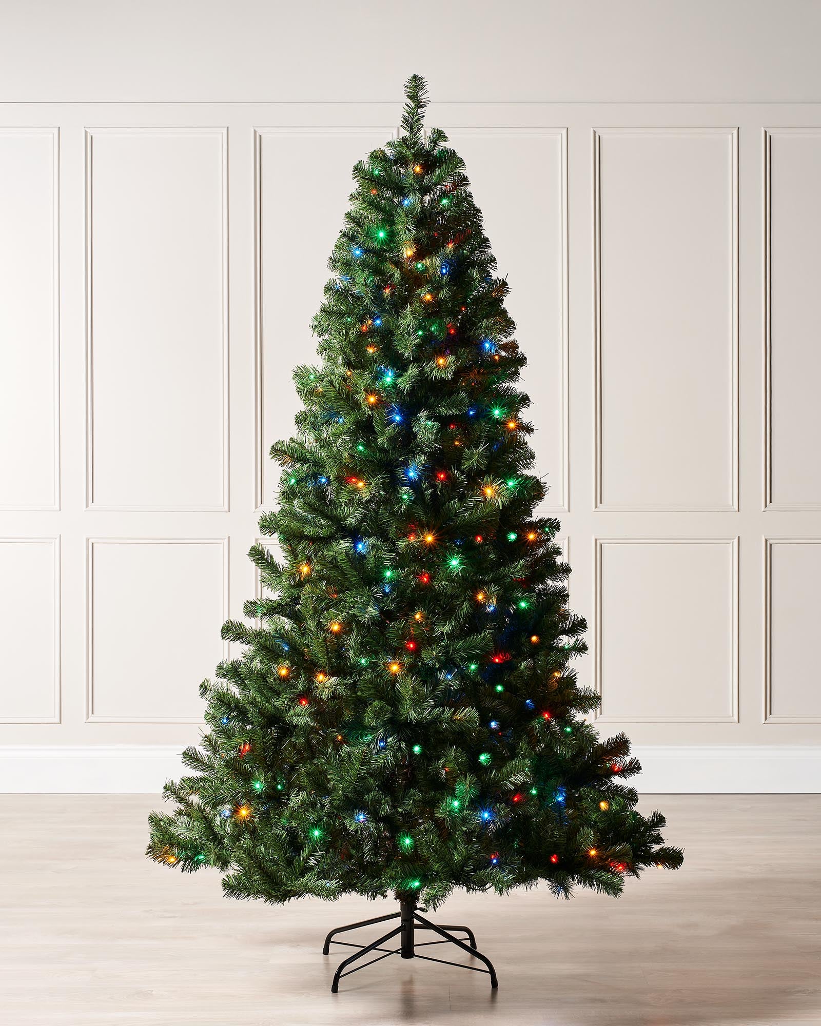 7 ft pre-lit emerald spruce Christmas tree with multi-coloured LEDs and a metal tree stand