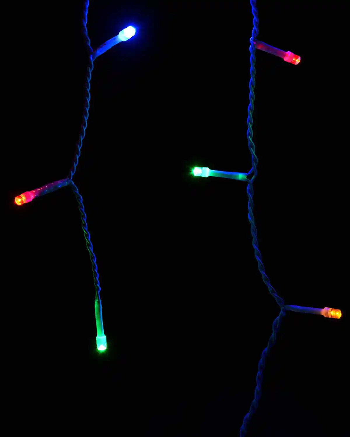 Close-up of multi-coloured LED icicle lights on hanging strands