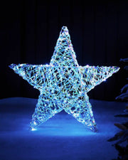 81cm pre-lit iridescent star silhouette glowing with white LEDs in an outdoor festive display.