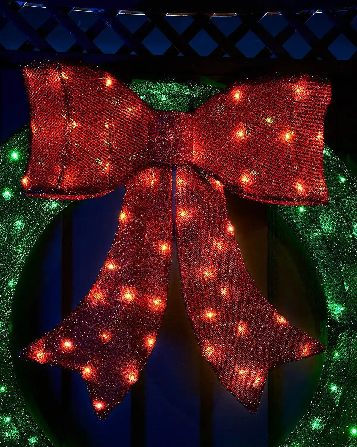 Close-up of the red bow with warm white LEDs on the 85cm pre-lit wreath silhouette.