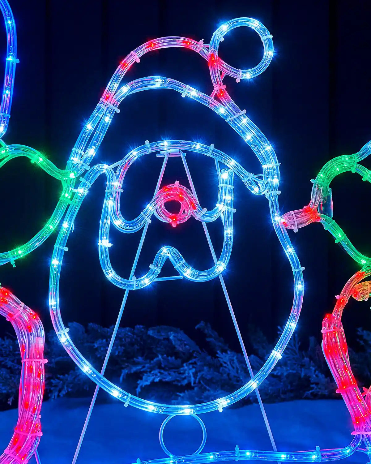 Close-up of the Santa face and hat on a multi-coloured rope light display
