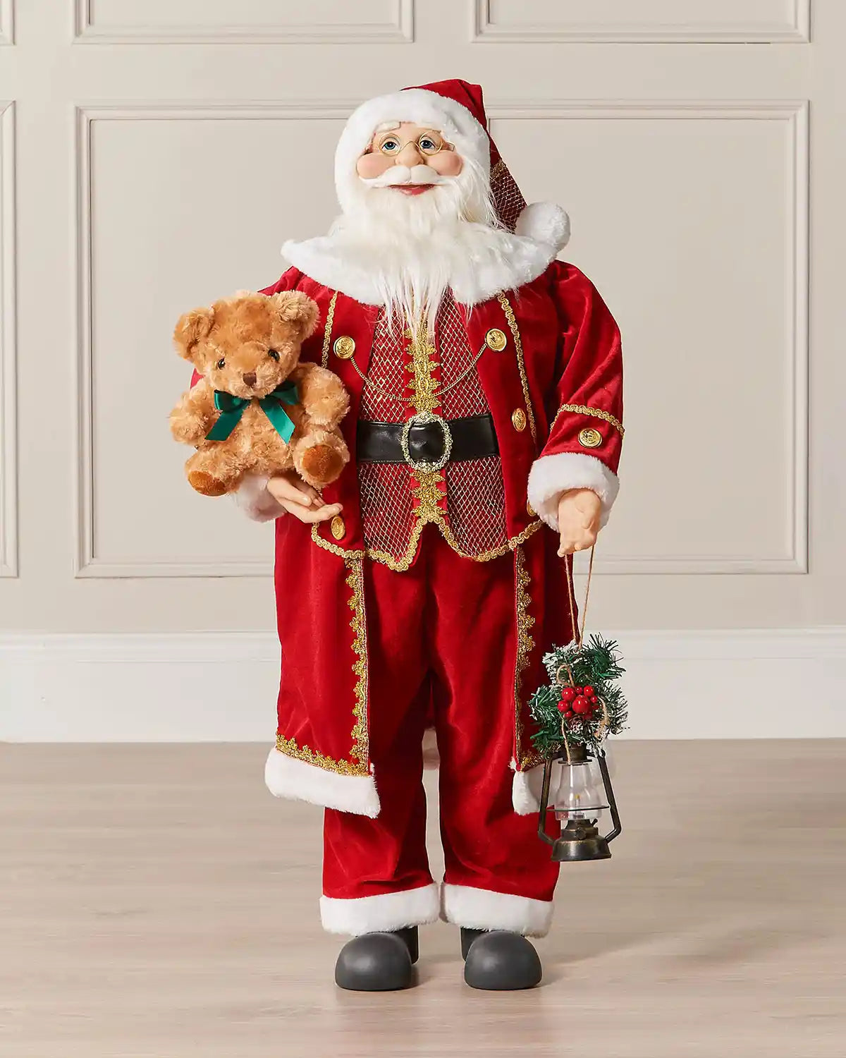 Large standing Santa figurine displayed indoors against a panelled wall