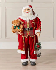 Large standing Santa figurine displayed indoors against a panelled wall