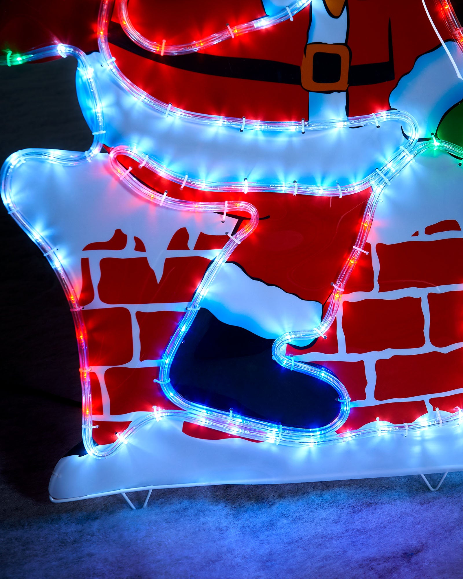 Close-up of the Santa on chimney silhouette showing multi-coloured rope lights, boot and chimney detail