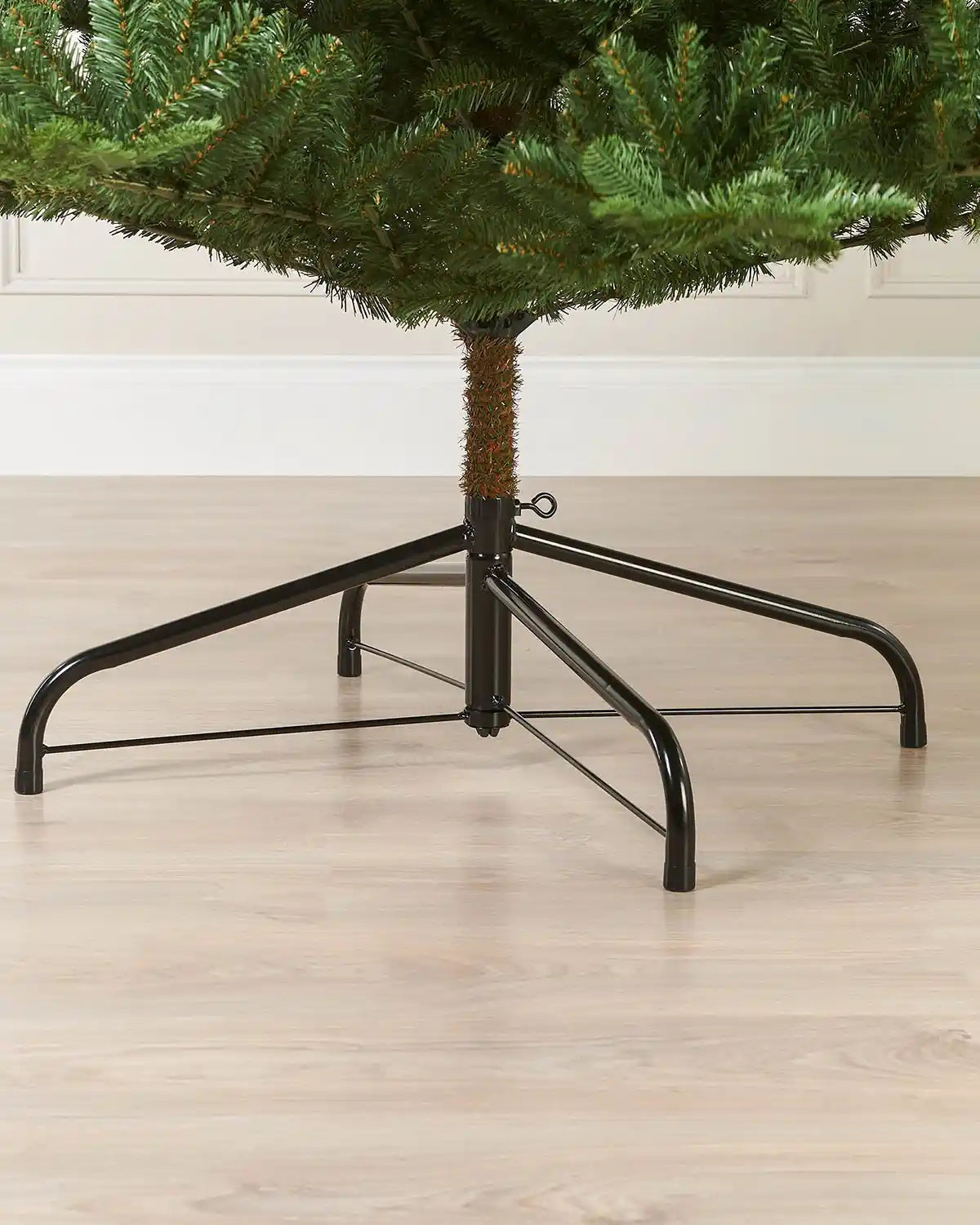 Close-up of the metal tree stand beneath a 9ft Nordmann fir Christmas tree