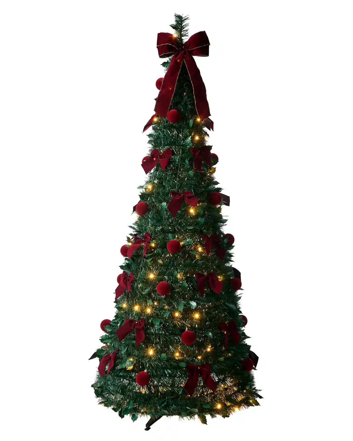 A decorated Holly Christmas tree with red ribbons, red ornaments, and warm white light
