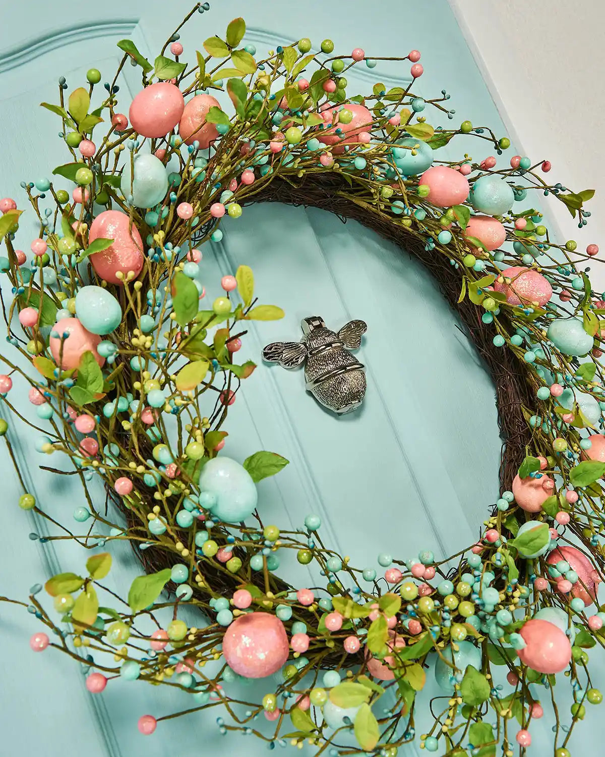 Artificial Floral Egg Spring Wreath, Blue & Pink, 28 Inch Closeup on Torquoise Door