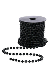 Black beaded garland in a spool on a white background