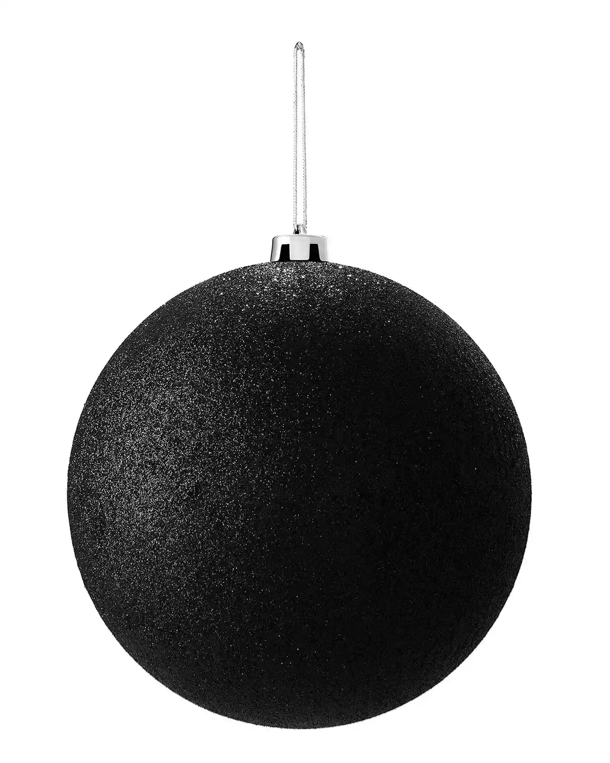 Black glittery oversized Christmas bauble on a white background