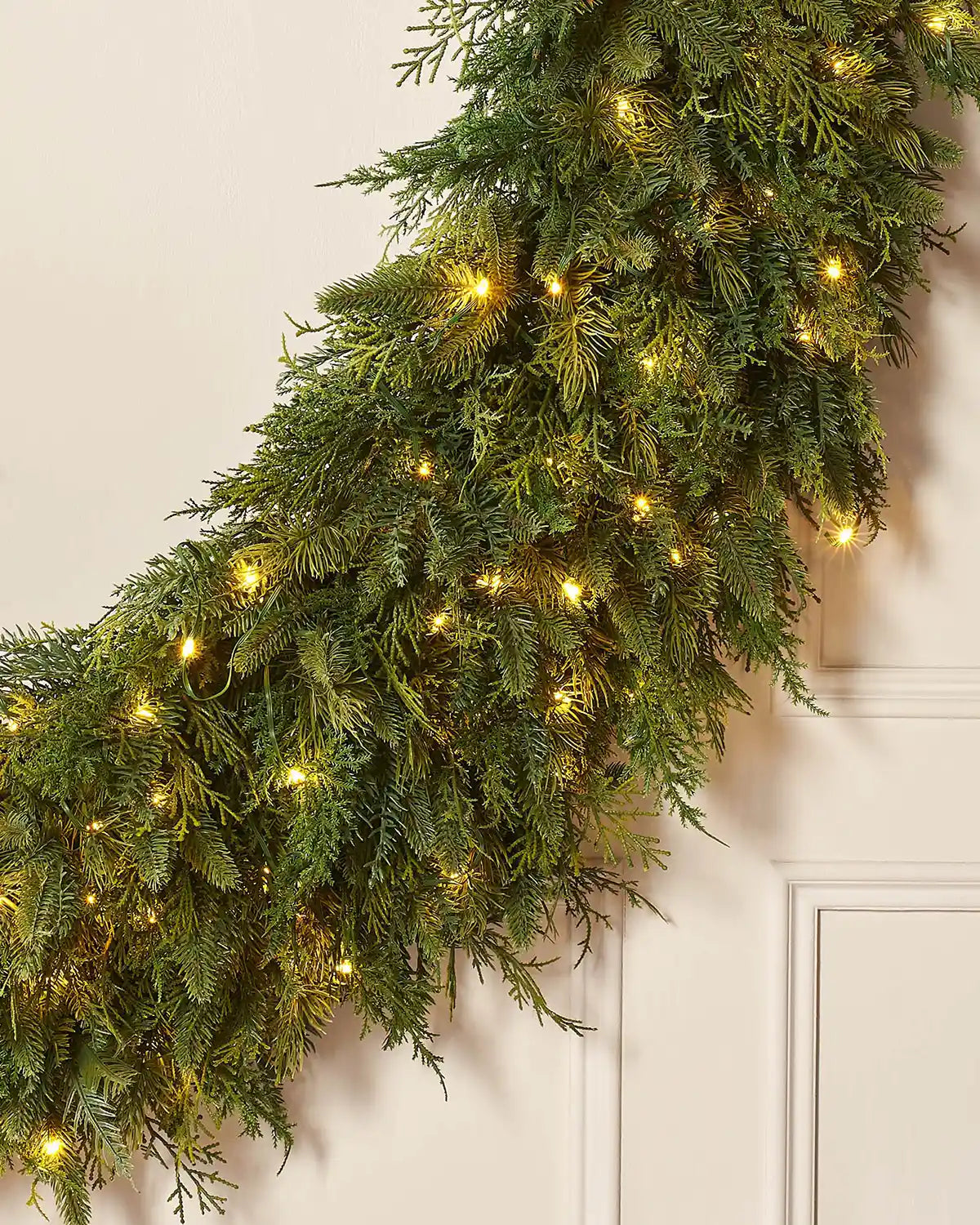 Bottom view of a Pre-Lit Natural Fir Majestic Wreath, 1.5 m on a panel texture background