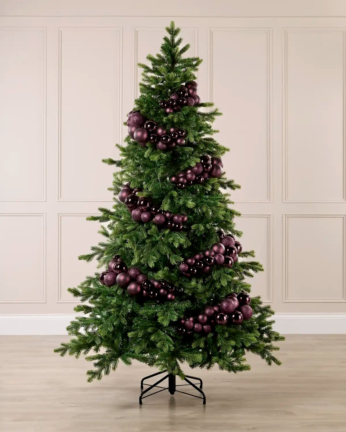 Burgundy Bauble Cluster Arch decorating a Christmas tree, with glossy, matte, and glitter burgundy baubles