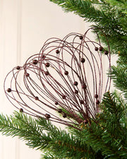Burgundy Glitter Nest Christmas Tree Pick placed in green Christmas tree branches with a cream background
