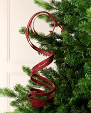 Burgundy Glitter Spiral Swirl Pick hanging from Christmas tree branch with cream background
