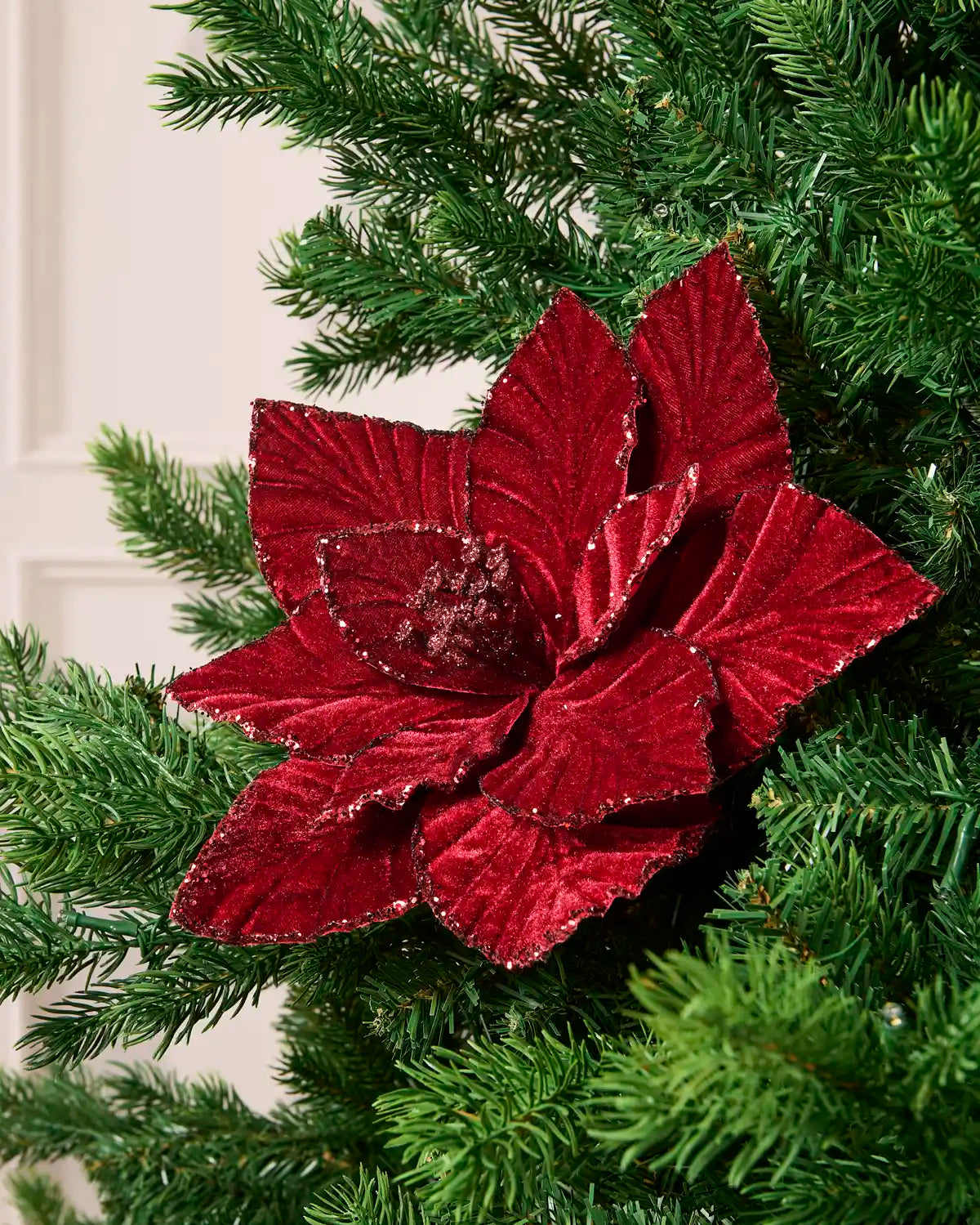 Burgundy velvet artificial poinsettia with glittered edges and a glittered center