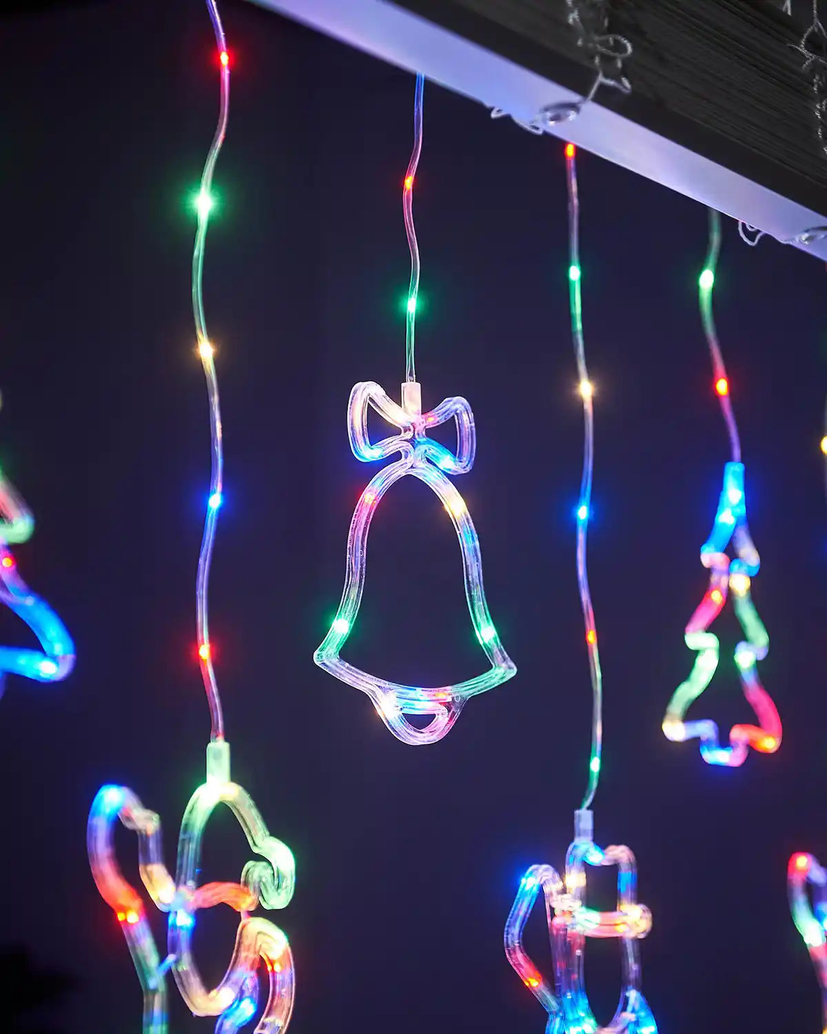 close up of Christmas Bell with bow on top in a window Christmas Character Curtain Light, 2.1 m 