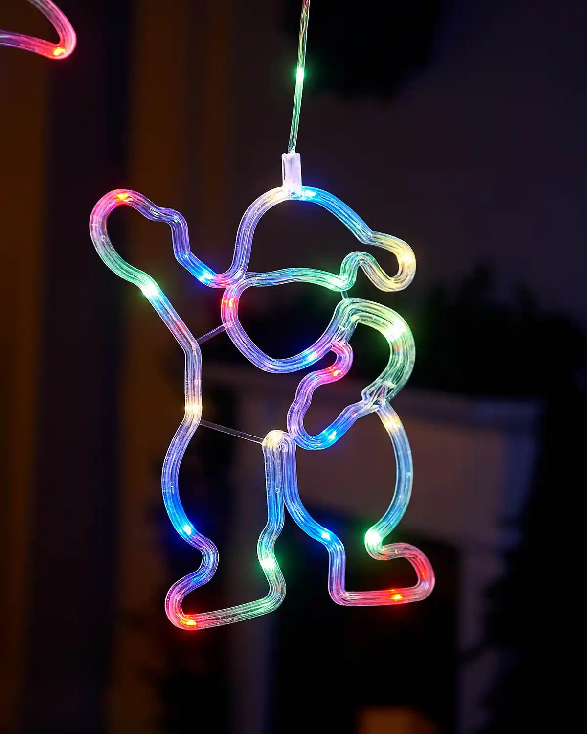 Close up of Christmas Santa Claus Character Curtain Light, 2.1 m on a window with a Christmas Tree in background