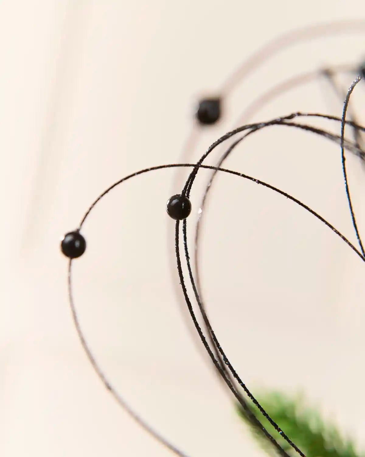 Close-up Black Glitter Nest Christmas Tree Pick highlighting the glitter details and Black balls