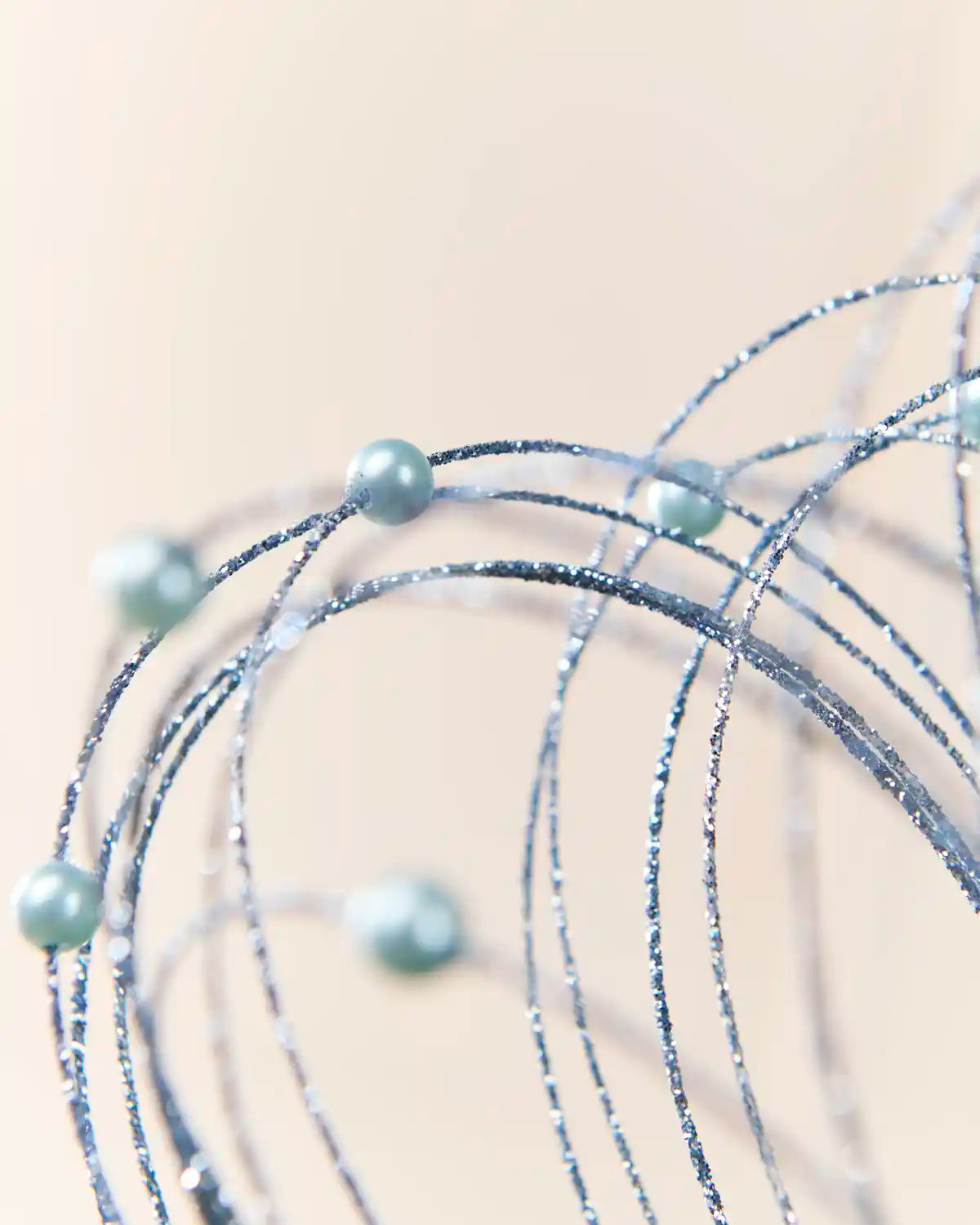 Close-up Ice Blue Glitter Nest Christmas Tree Pick highlighting the glitter details and Ice Blue balls