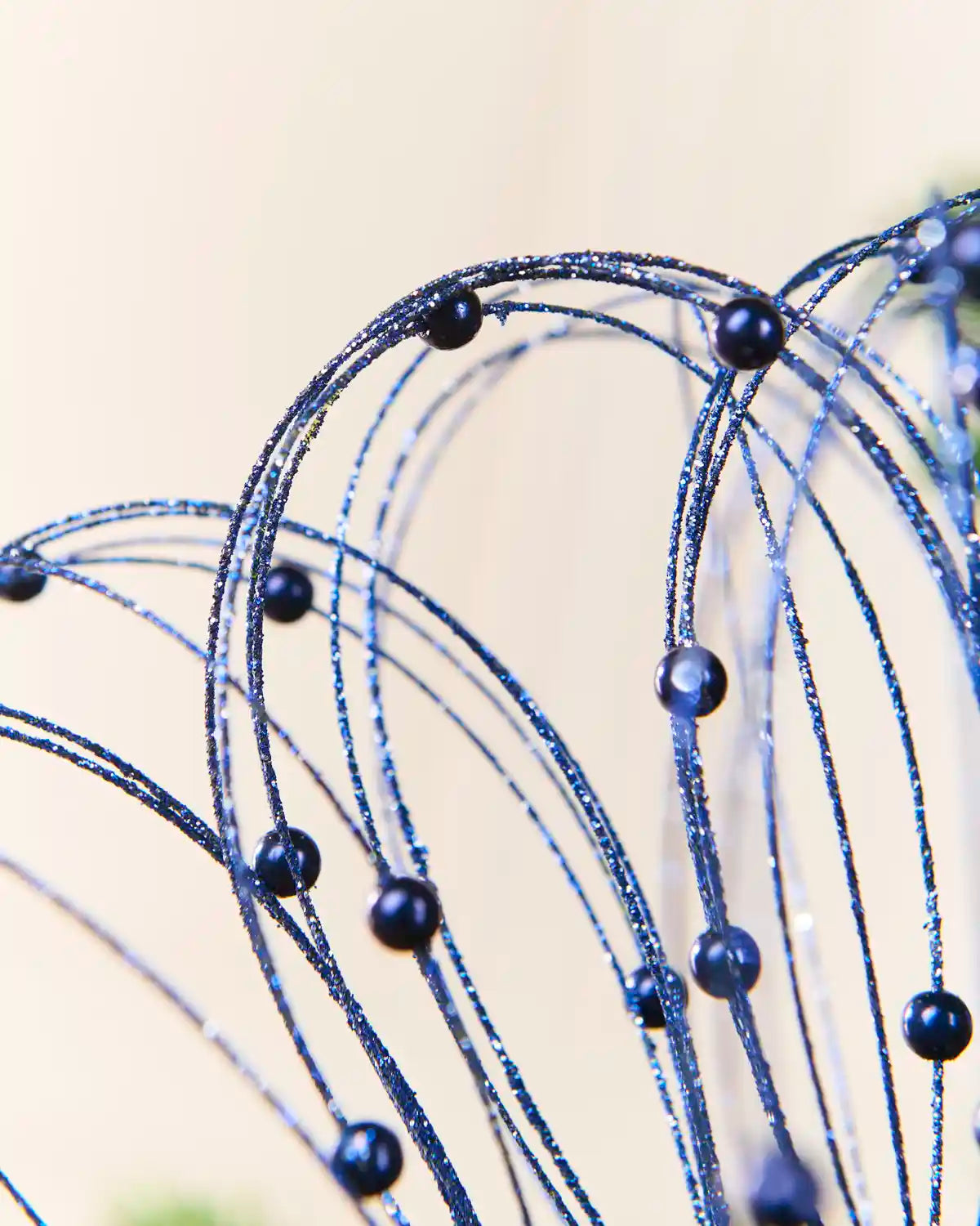 Close-up Navy Glitter Nest Christmas Tree Pick highlighting the glitter details and Navy balls