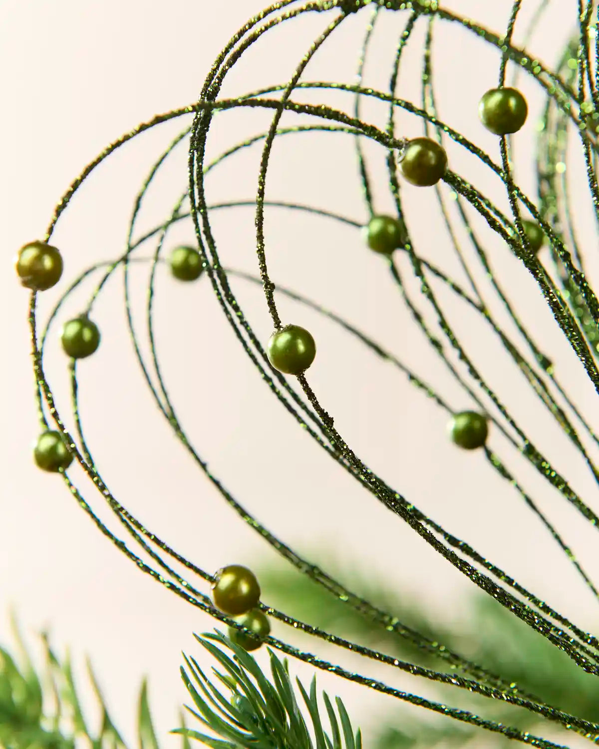 Sage green Glitter Nest Christmas Tree Pick highlighting the glitter details and Sage green balls