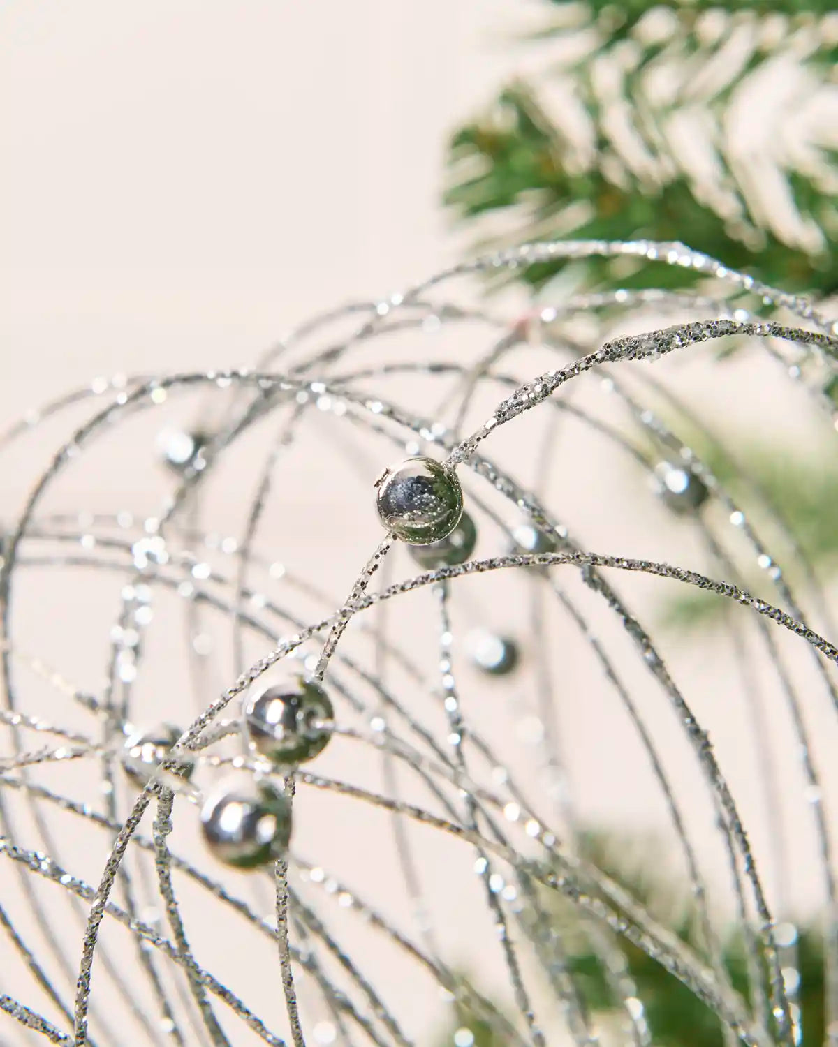 Close-up Silver Glitter Nest Christmas Tree Pick highlighting the glitter details and Silver balls