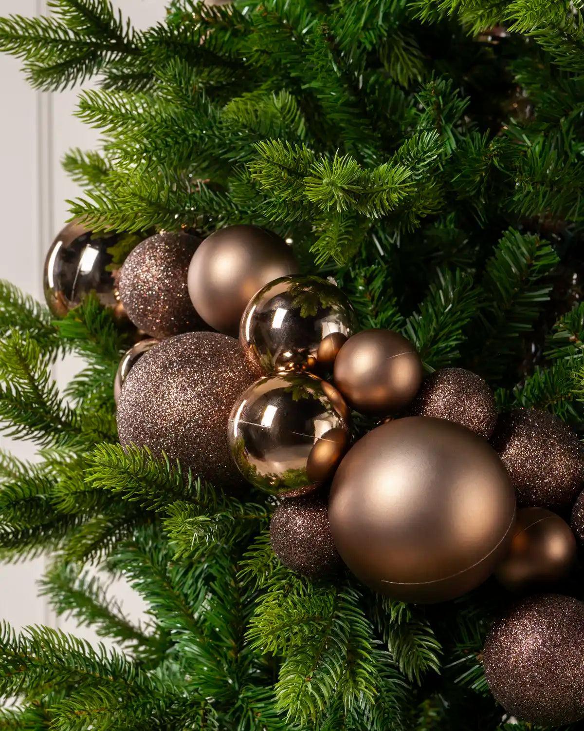 Close-up of Mocha Bauble Garland featuring mocha, glitter and metallic baubles