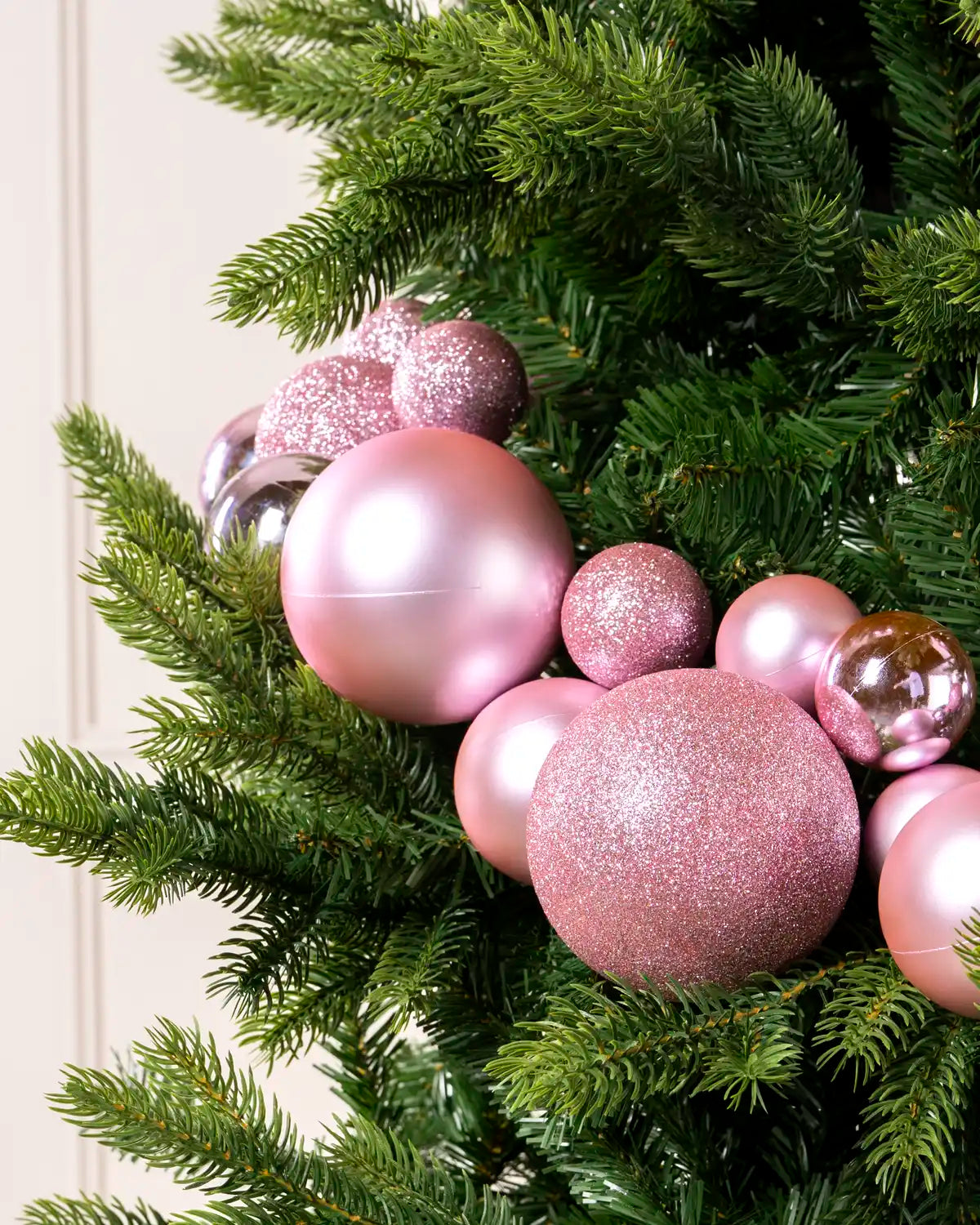 Close-up of Pink Bauble Garland featuring pink, glitter and metallic baubles