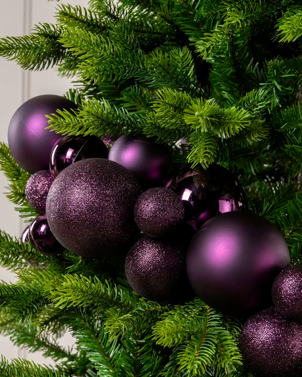 Close-up of Purple Bauble Garland featuring purple, glitter and metallic baubles