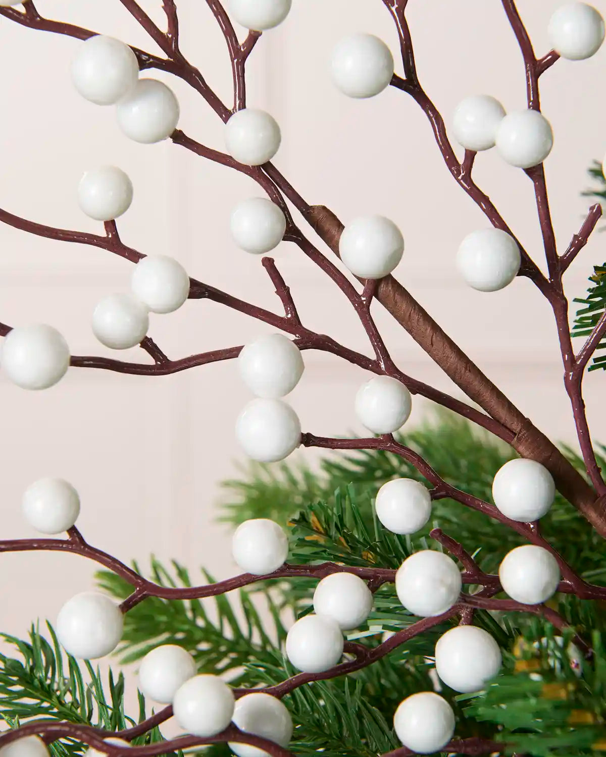 Close-up of White Berries on the White Berry Christmas Tree Pick placed in a Christmas tree