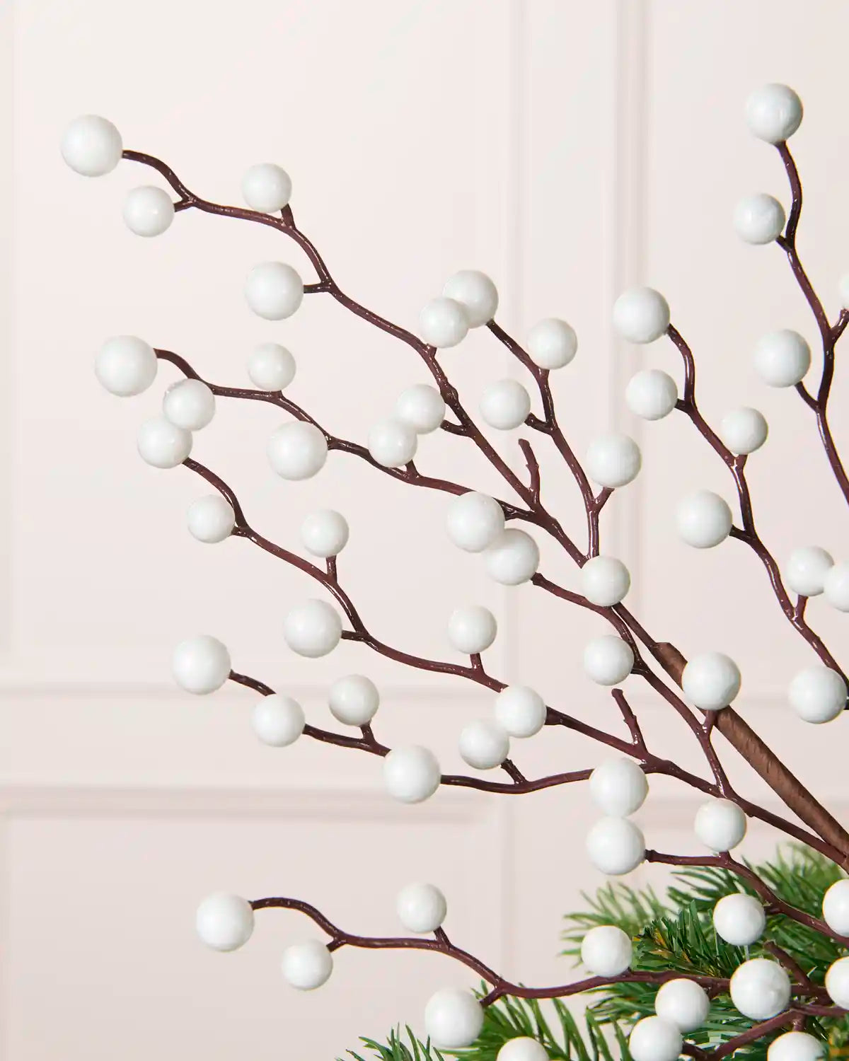 Close-up of White Berry Christmas Tree Pick placed in a Christmas tree