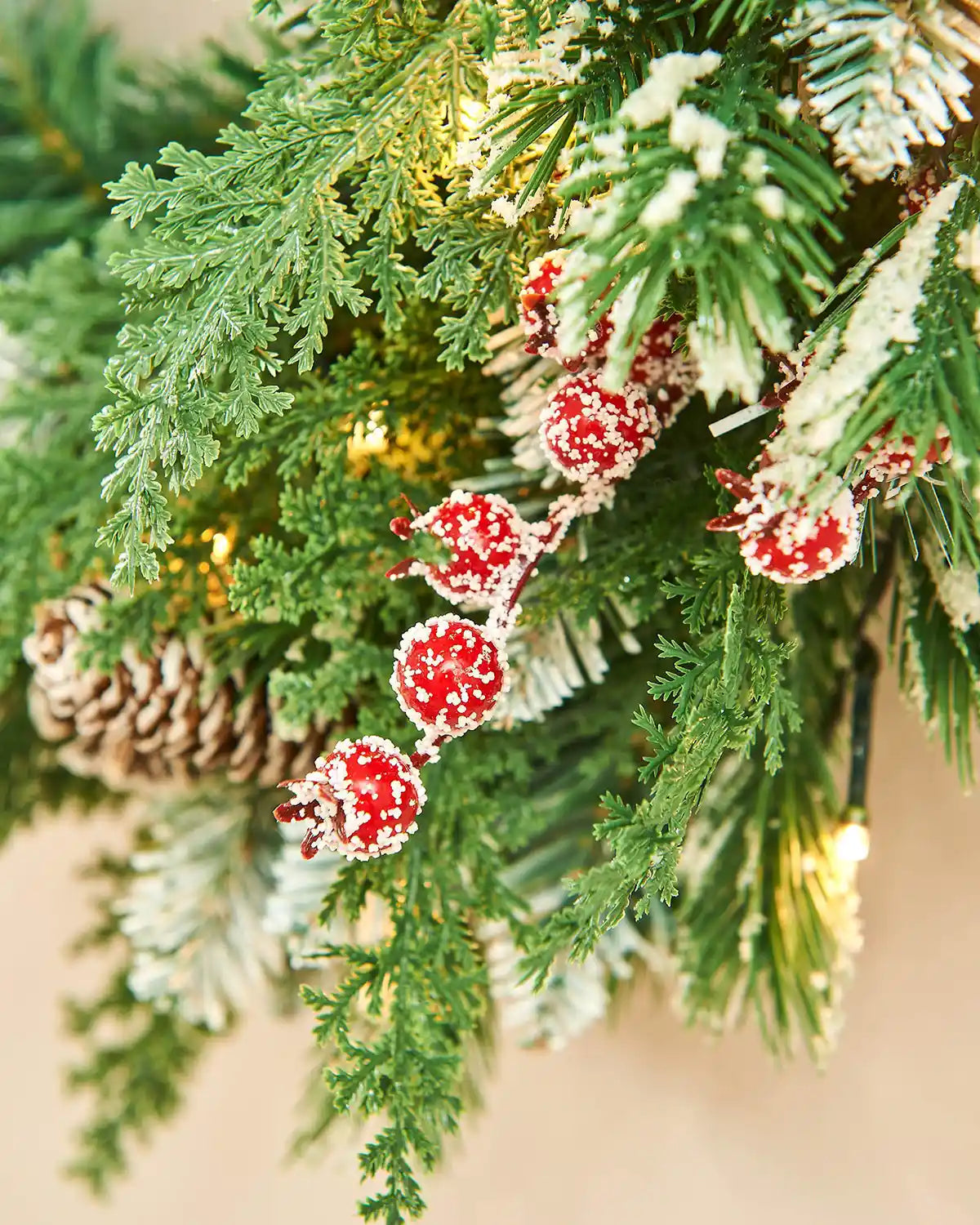 Close-up of a Christmas wreath cones and frosted berries.