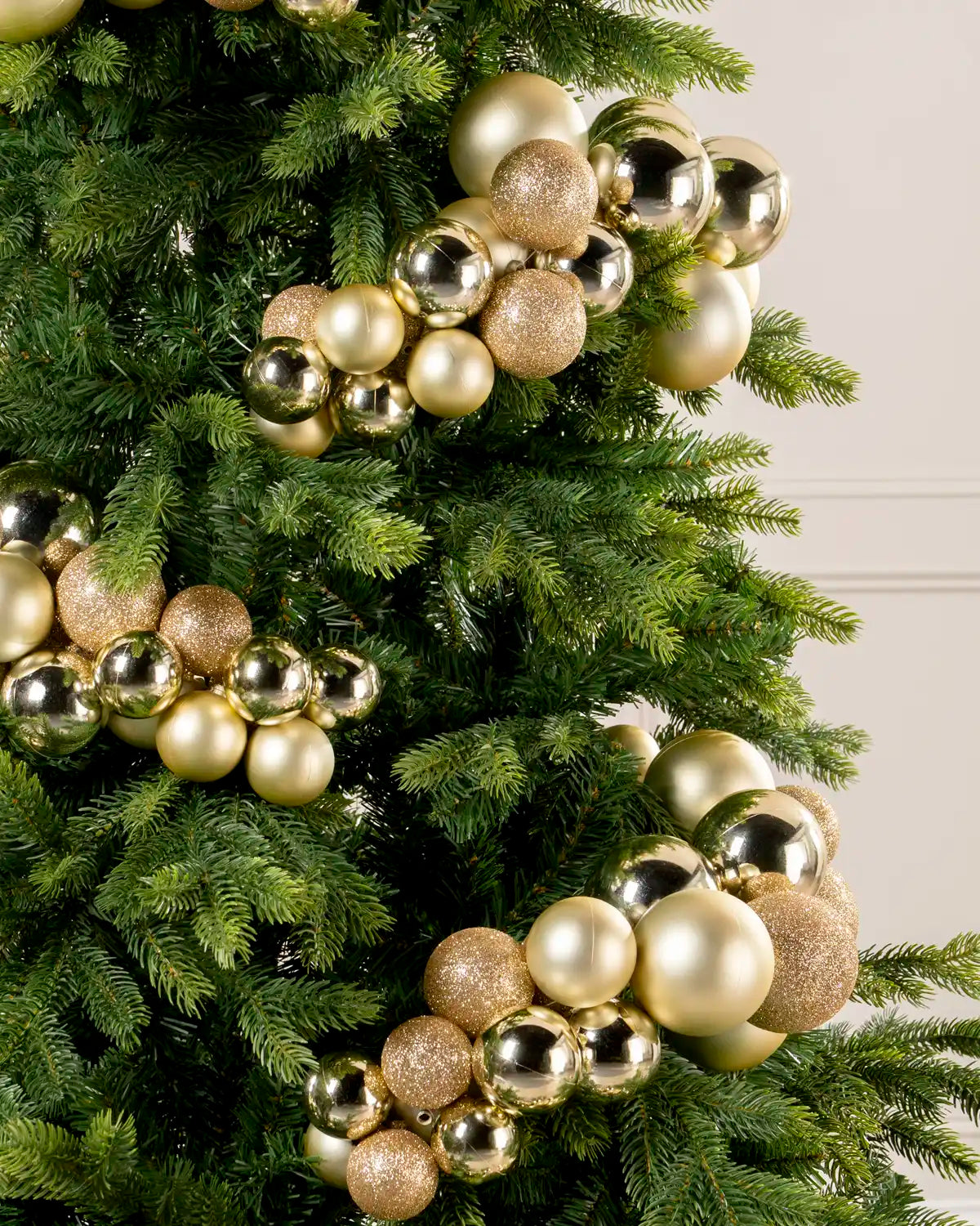 Close-up of a Gold Bauble Cluster Arch on a Christmas tree