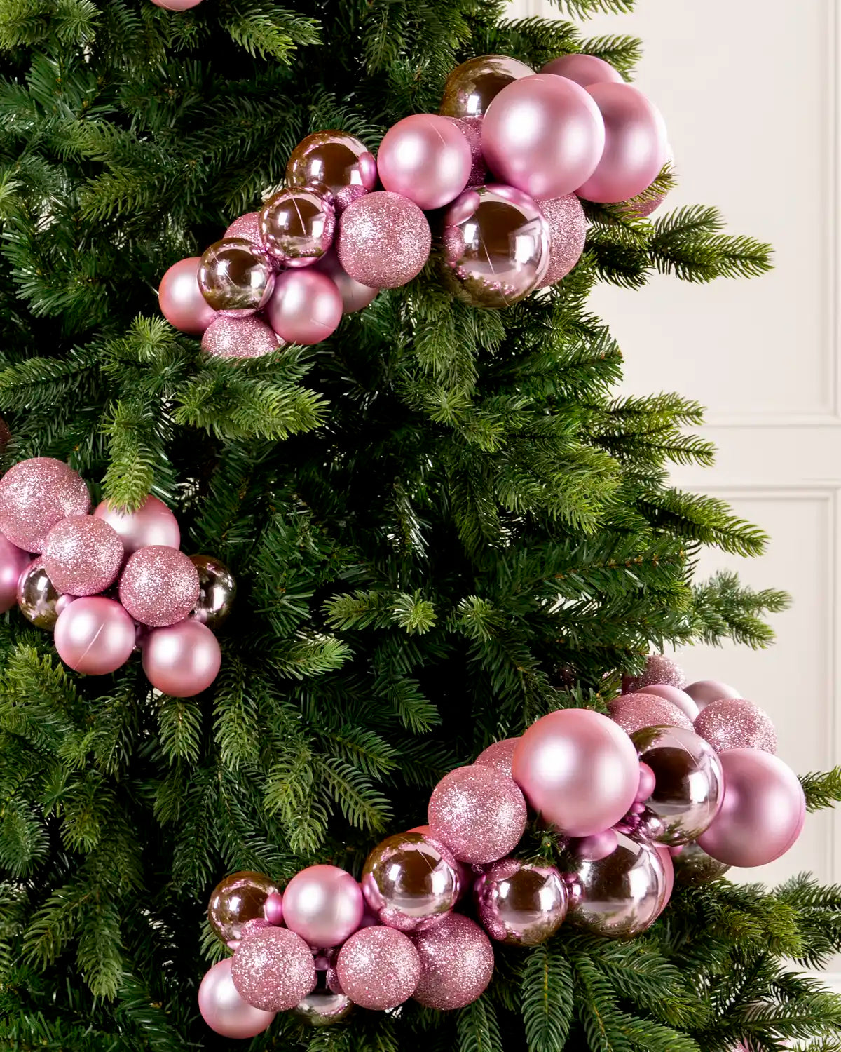 Close-up of a Pink Bauble Cluster Arch on a Christmas tree