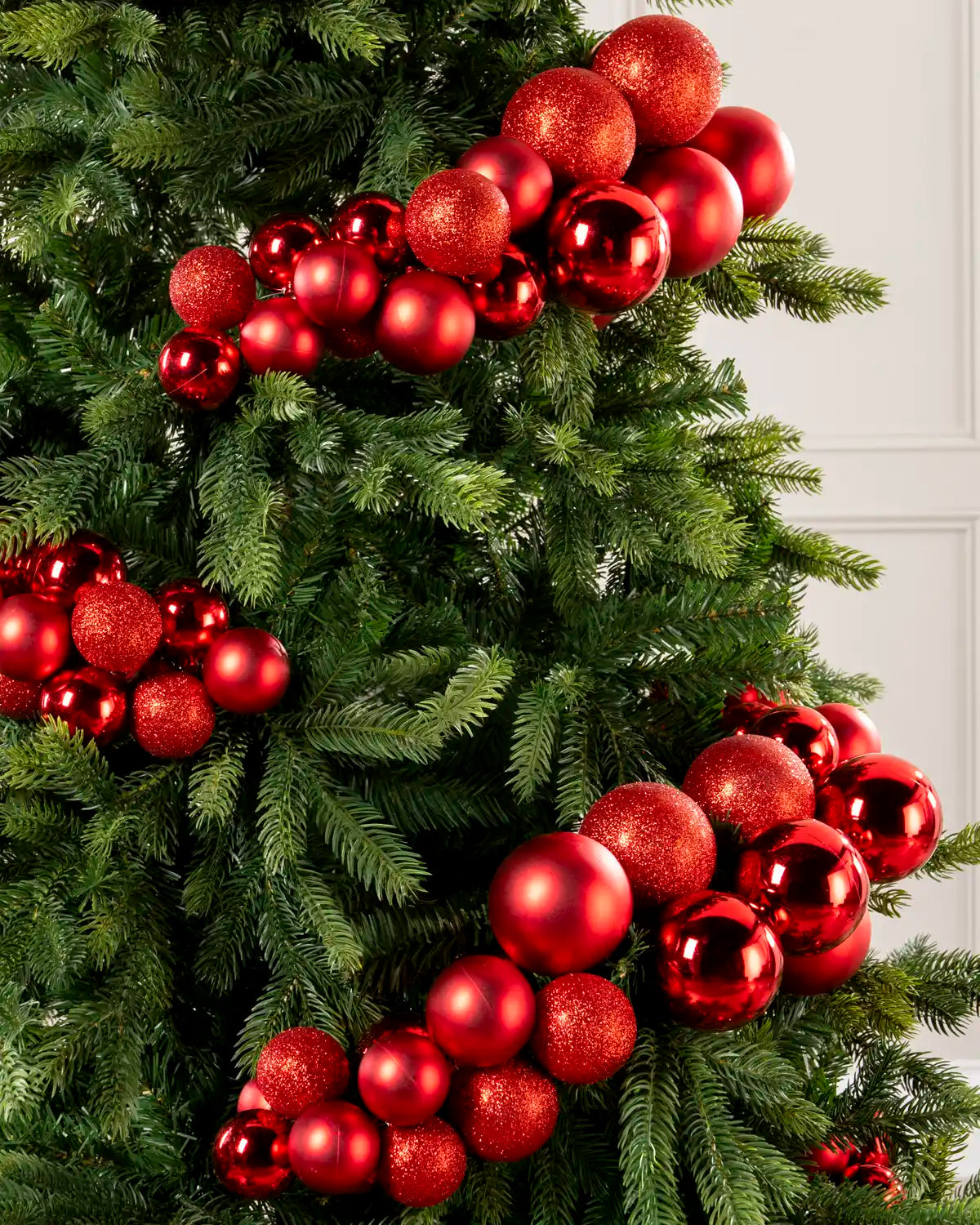 Close-up of a Red Bauble Cluster Arch on a Christmas tree
