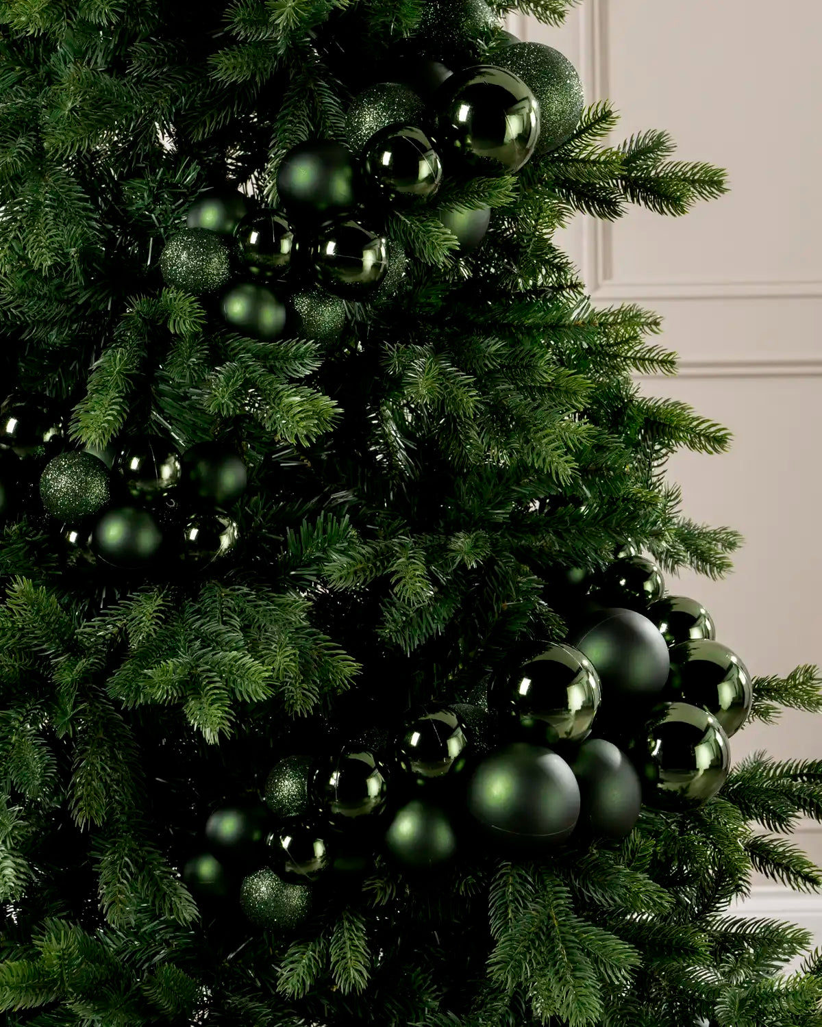 Close-up of a Sage Green Bauble Cluster Arch on a Christmas tree