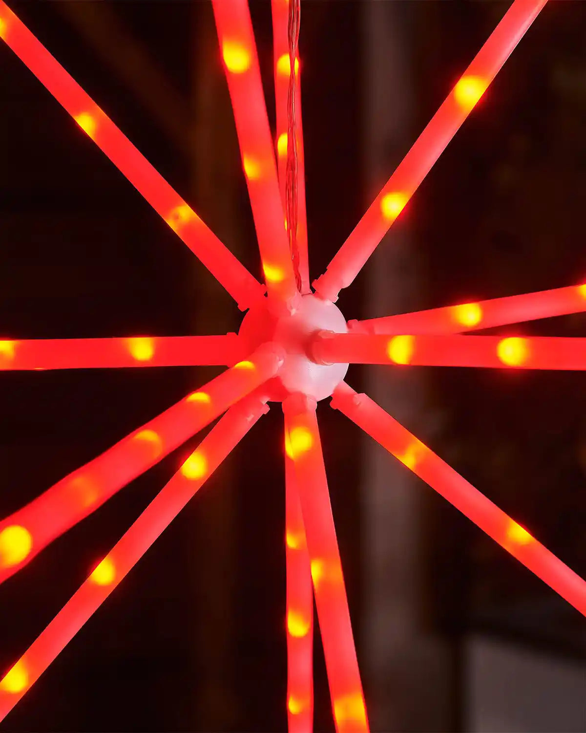 Close-up of a red LED light fixture on a dark background