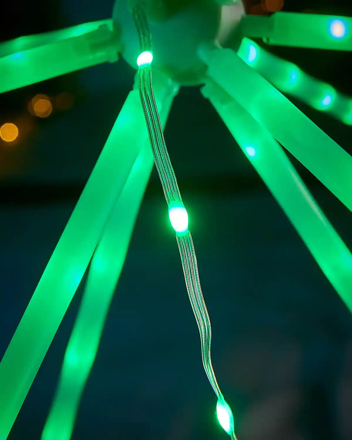 Close-up of green LED Star light on a dark background