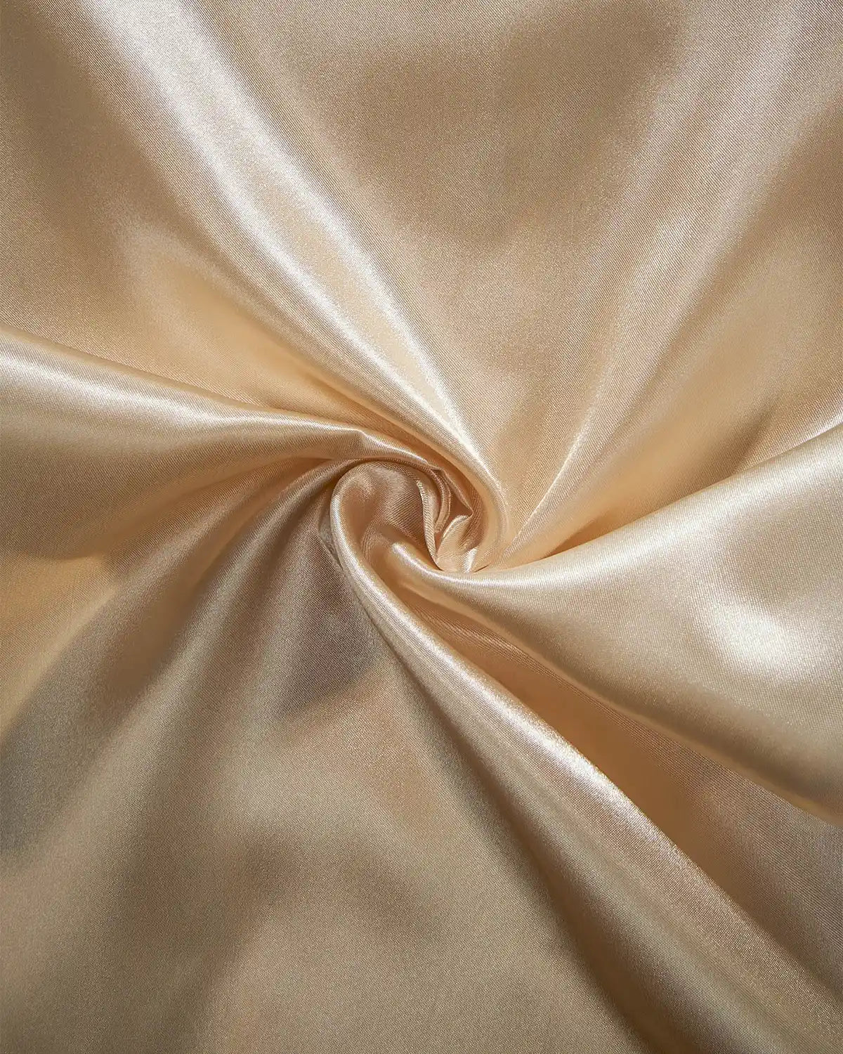 Close-up of latte satin fabric with a swirl pattern